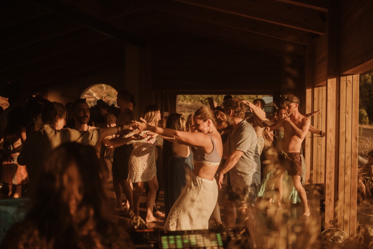 Golden light on the dance floor at conscious dance event near Sintra