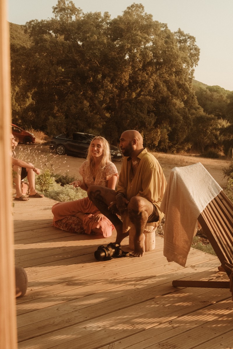 Two people connecting on the deck at ecstatic dance festival near Lisbon