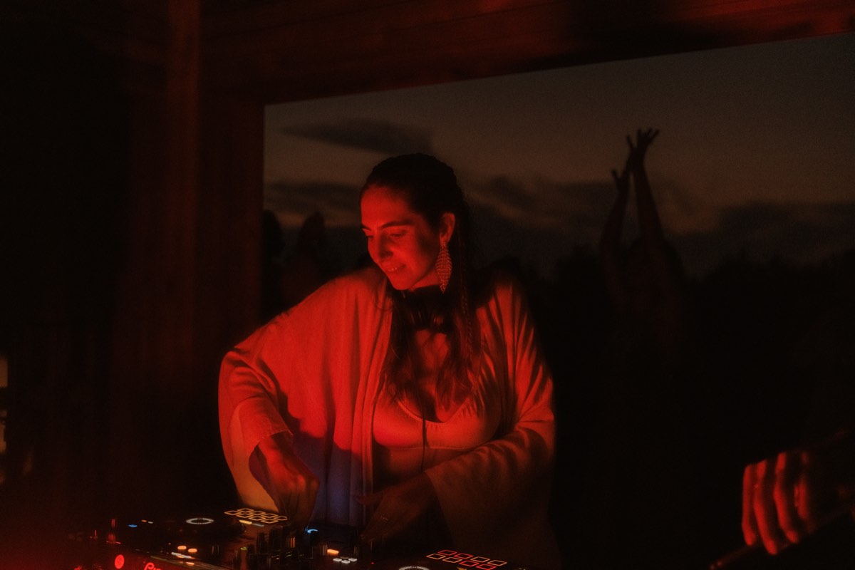 Night DJ set with atmospheric lighting at EDLX equinox dance event
