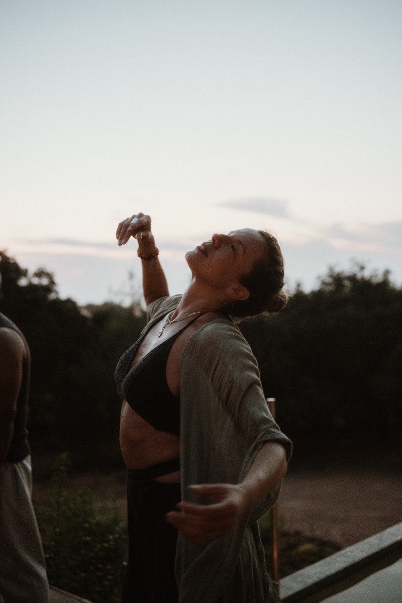 Dancer in freeform expression at barefoot ecstatic dance festival