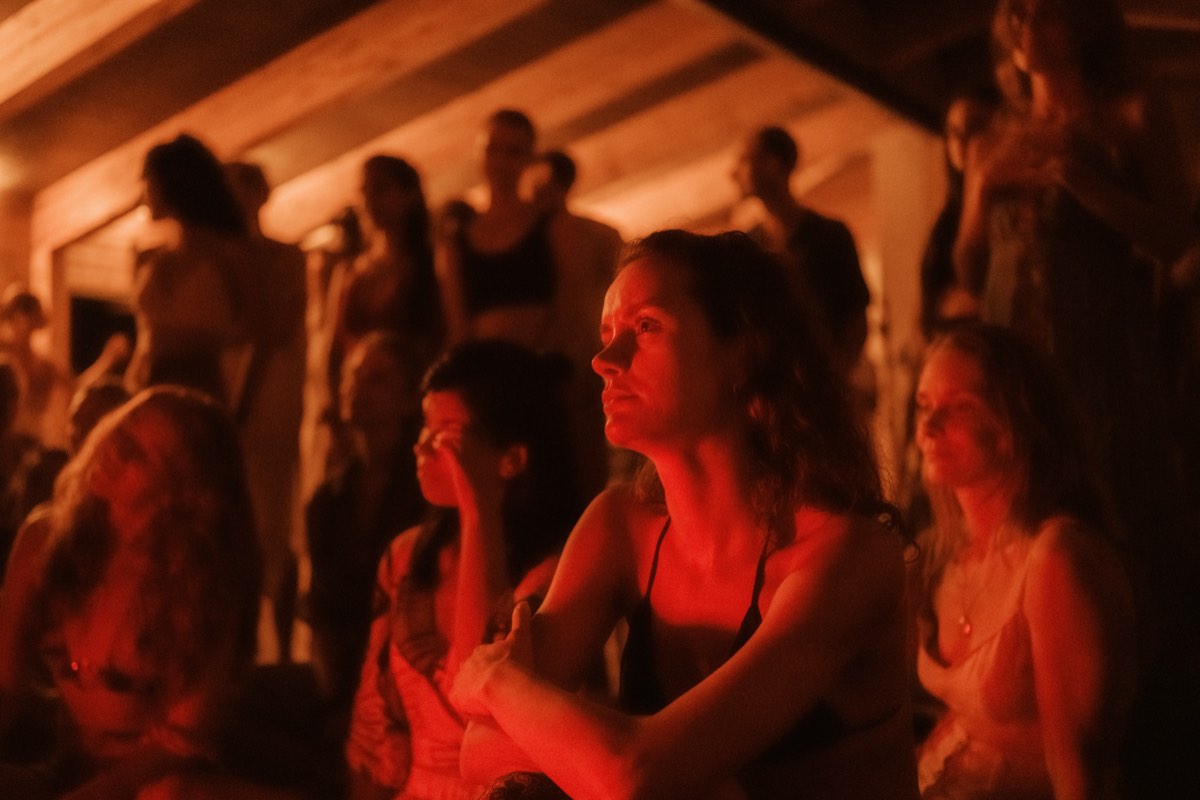 Night circle gathering with lights at conscious dance festival Portugal